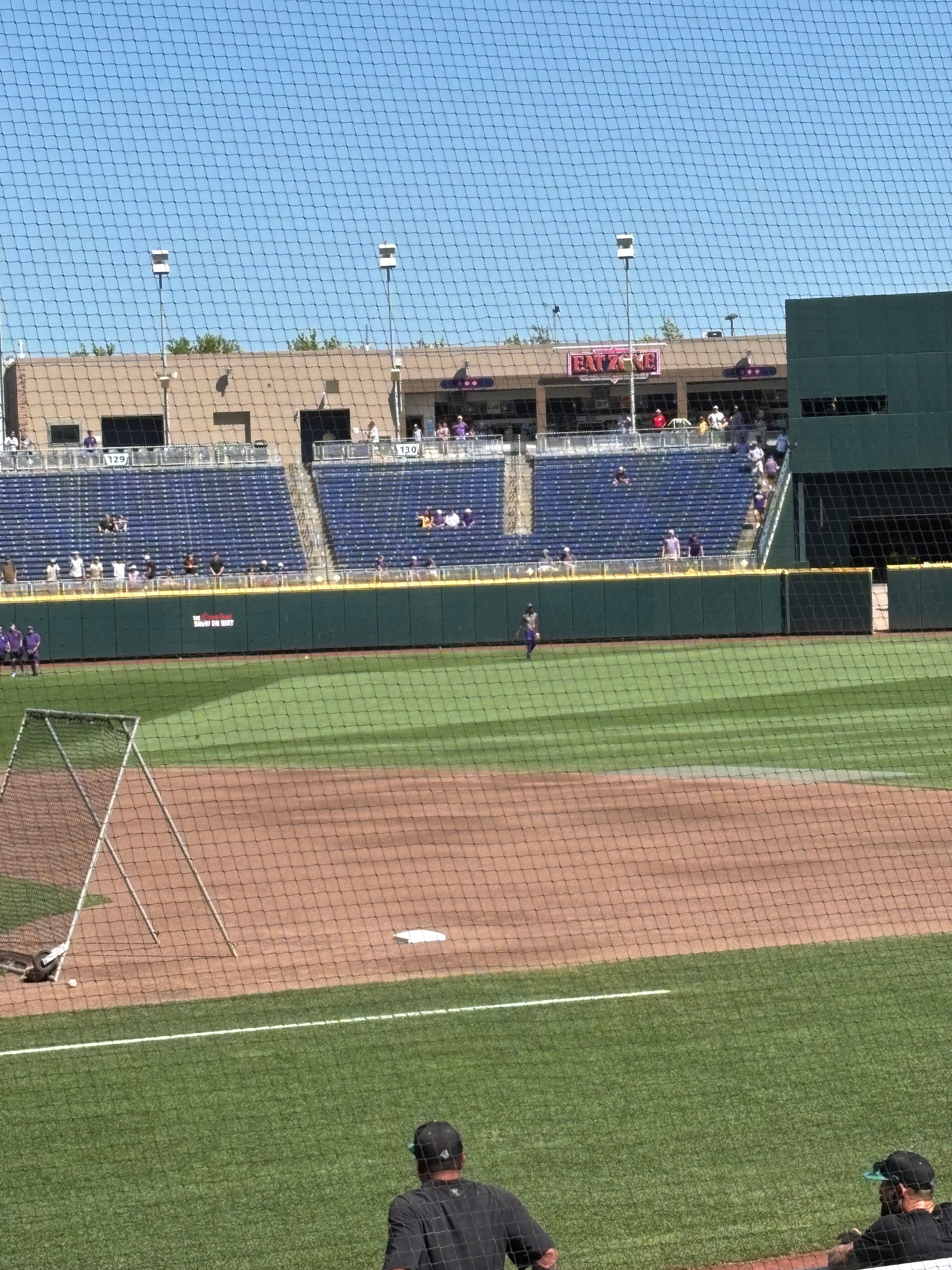 Sitting at the college world series baseball game in the heat