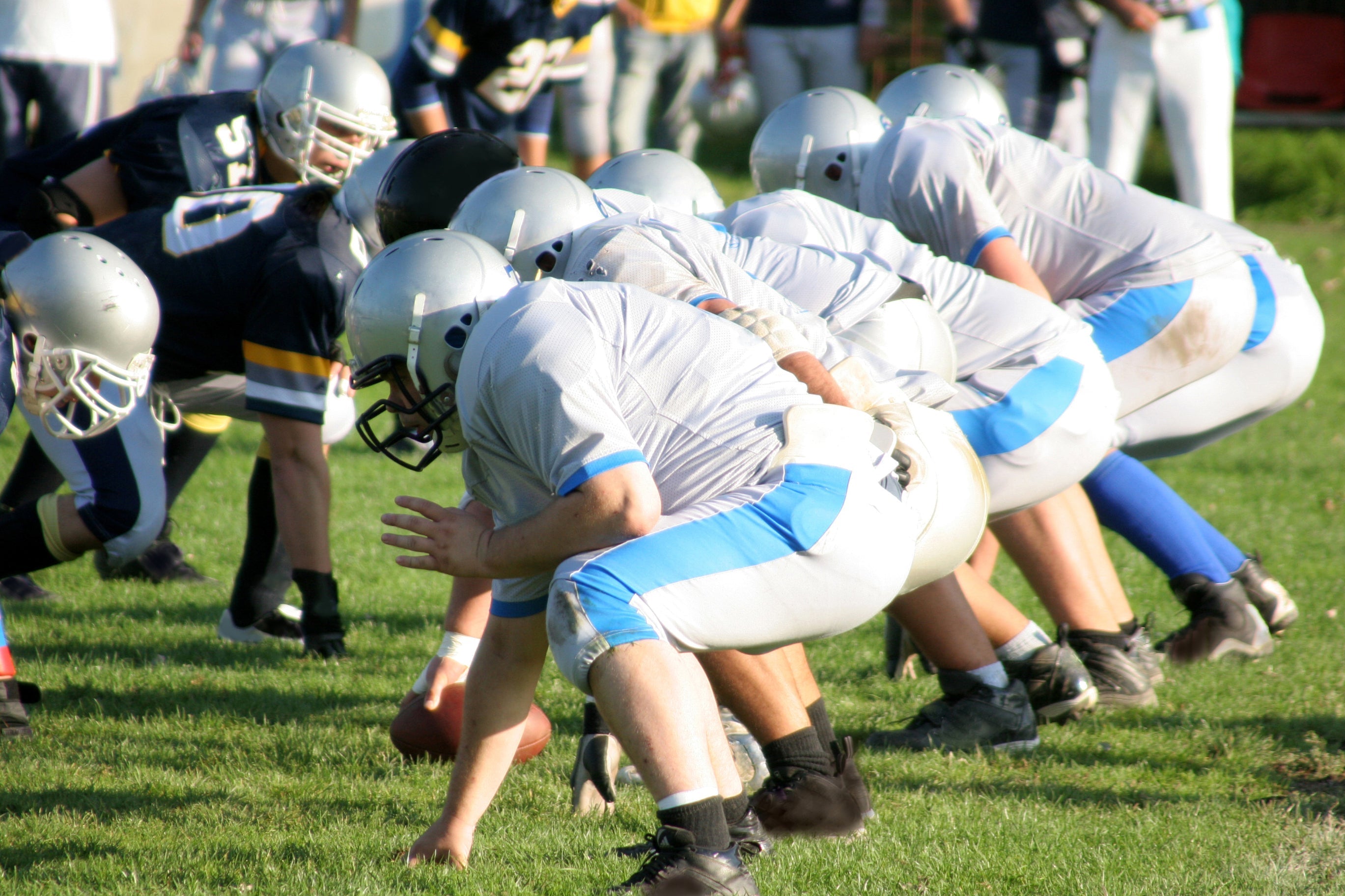 Youth football players on the line of scrimmage