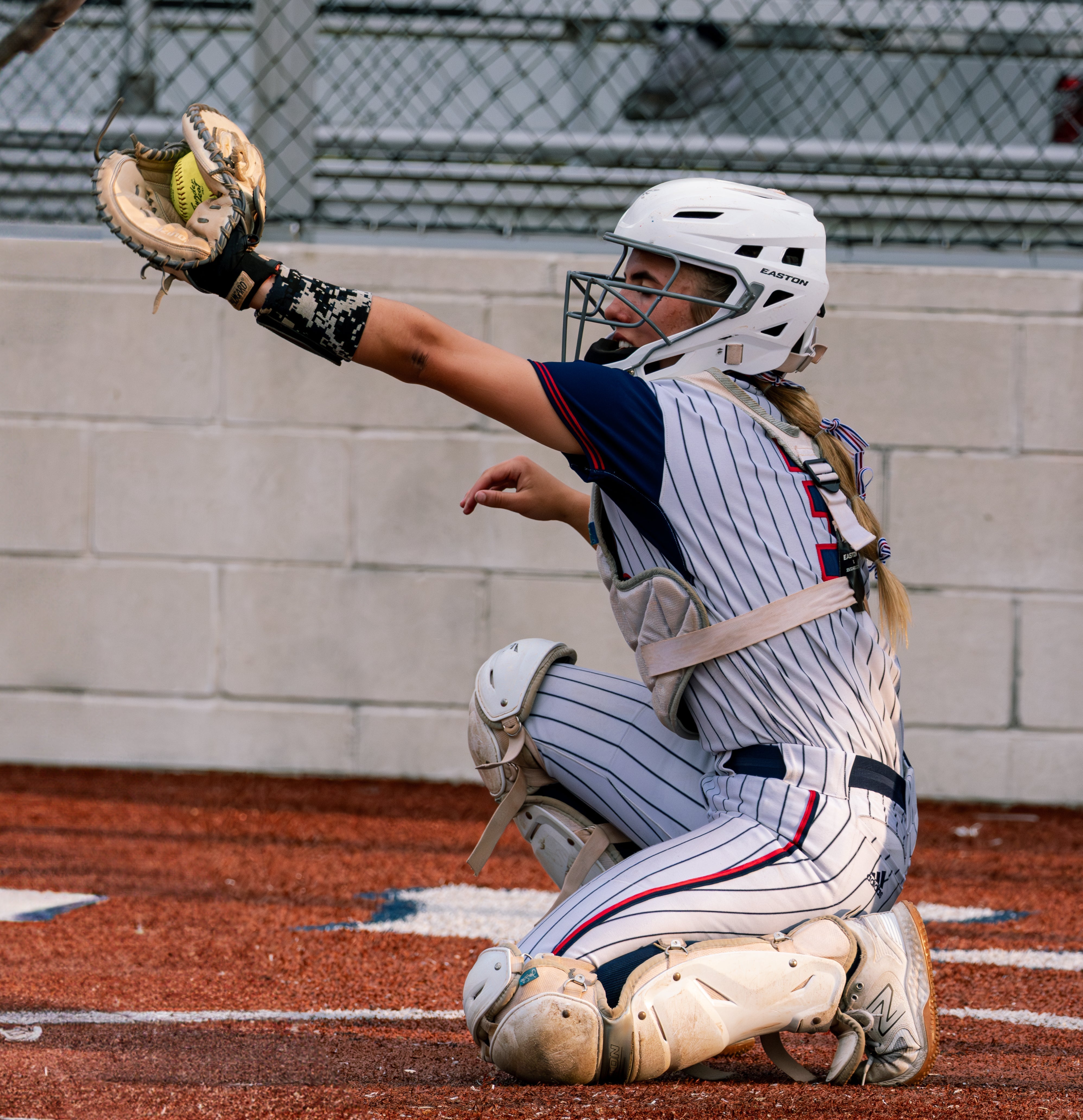 Softball catcher in the summer heat
